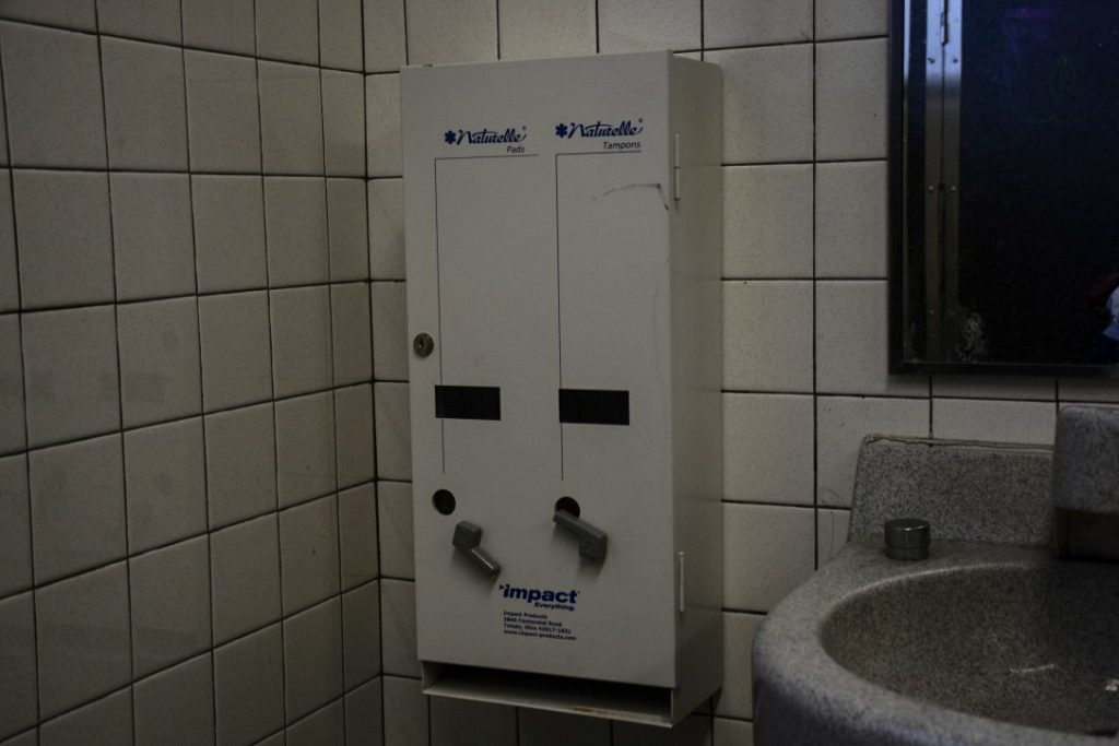 A pad and tampon dispenser sits empty in a BHS girls’ bathroom.