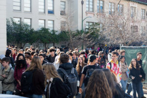 At 12:41 PM, all 3,000 BHS students flood out of their classes to get lunch. Some make their way off campus to buy lunch, others go to the cafeteria to get free school lunch. Some wait by the student-dubbed glass doors for their friends to make their way through the mass of people to the doors so they can get lunch.