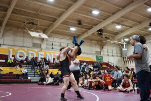 Gabe Ross hefts an opponent over his shoulder at San Lorenzo High School on January 12.
